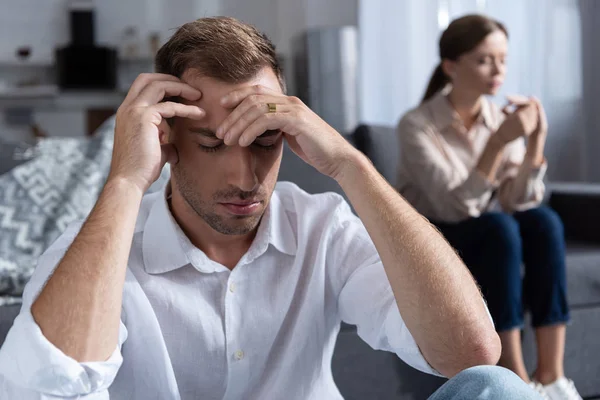 Pensive upset couple in living room at home — Stock Photo