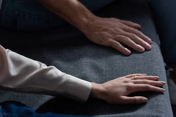 Partial view of man and woman on sofa at home — Stock Photo