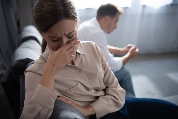 Pensive upset couple in living room at home — Stock Photo