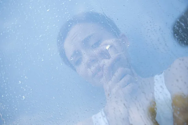 Selective focus of stressed young woman crying at home — Stock Photo