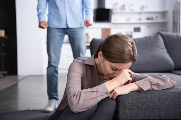 Partial view of man and upset crying woman at home — Stock Photo