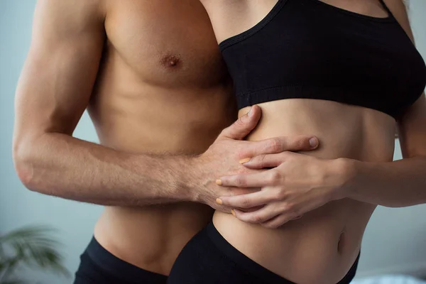 Cropped view of seductive man touching sexy woman — Stock Photo