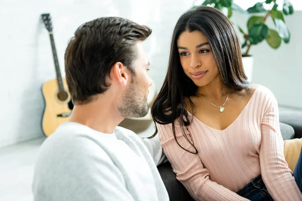 Attractive african american woman looking at her boyfriend in apartment — Stock Photo