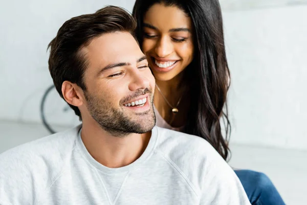 Smiling african american woman and handsome man with closed eyes — Stock Photo