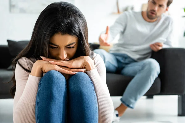 Selective focus of sad african american woman in apartment — Stock Photo