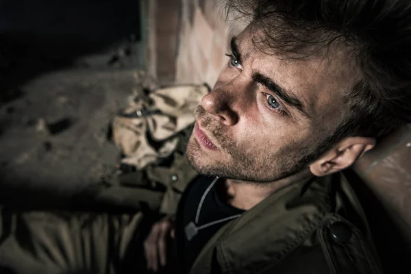 Selective focus of handsome man suffering pain, post apocalyptic concept — Stock Photo