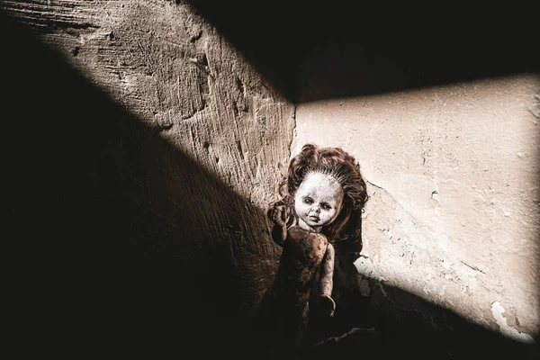 Top view of dirty and scary baby doll on ground, post apocalyptic concept — Stock Photo