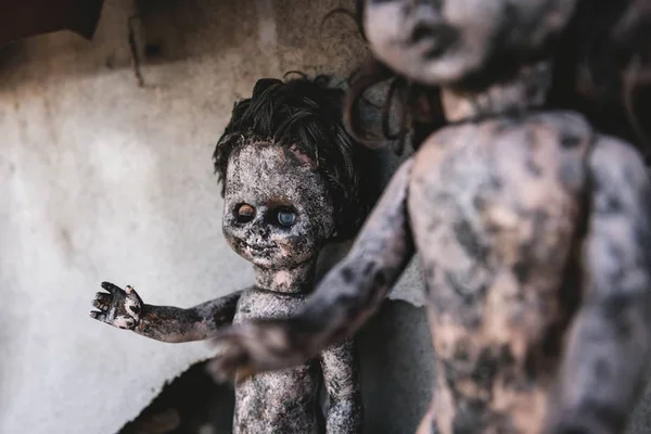 Selective focus of scary and burnt baby dolls, post apocalyptic concept — Stock Photo