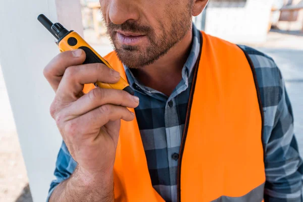 Cropped view of bearded man holding walkie talkie — Stock Photo