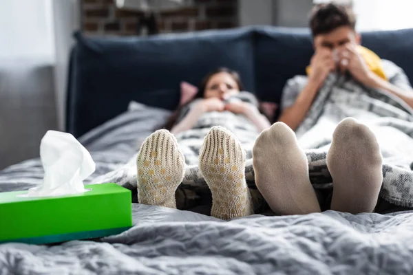 Selective focus of girlfriend and boyfriend in wool socks — Stock Photo