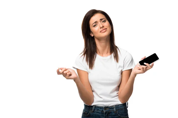 Upset young woman holding smartphone with blank screen, isolated on white — Stock Photo