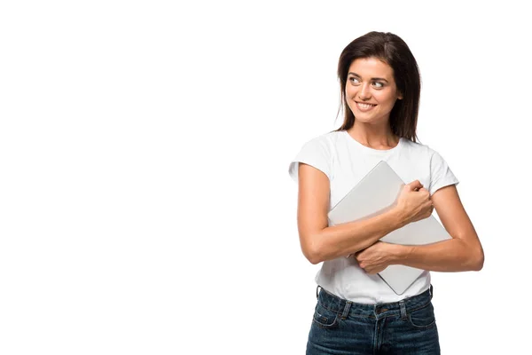 Atractiva mujer alegre sosteniendo portátil, aislado en blanco - foto de stock