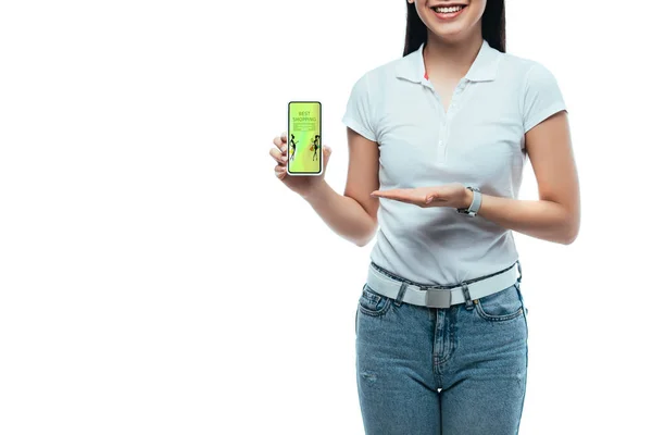 Cropped view of happy brunette asian woman presenting smartphone with best shopping app isolated on white — Stock Photo