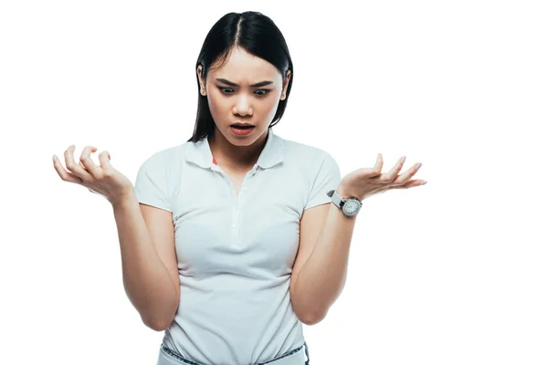 Shocked attractive asian girl showing shrug gesture isolated on white — Stock Photo