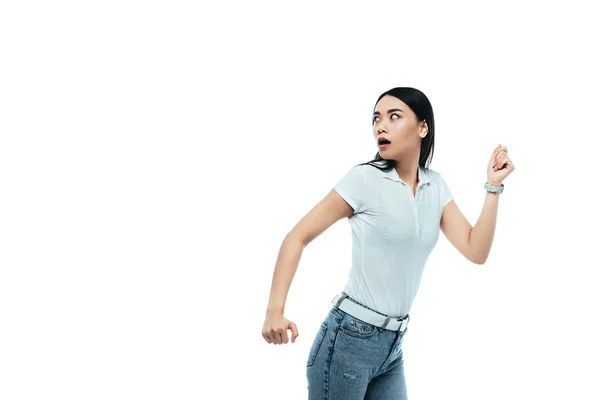 Scared attractive asian girl running away isolated on white — Stock Photo