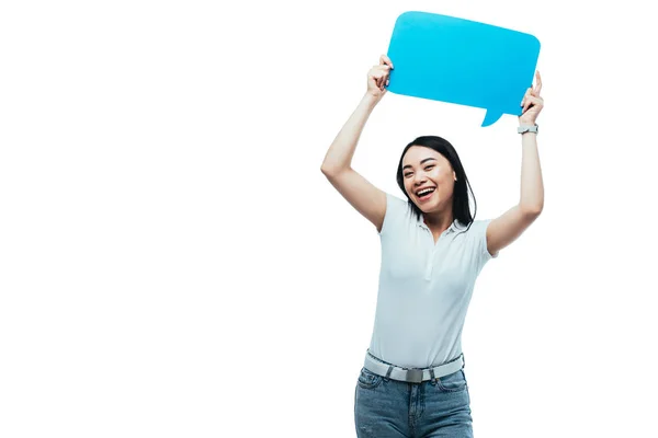 Happy asian girl holding blue blank speech bubble isolated on white — Stock Photo