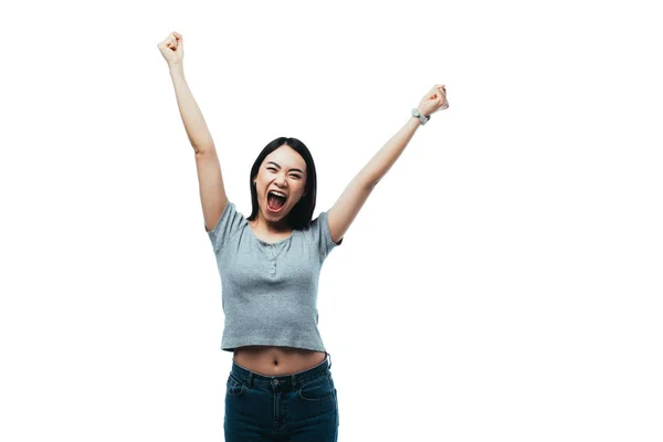 Happy asian girl showing yeah gesture with open mouth isolated on white — Stock Photo