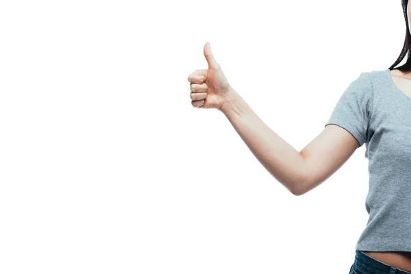 Обрізаний вид дівчини, що показує великий палець вгору ізольовано на білому — стокове фото