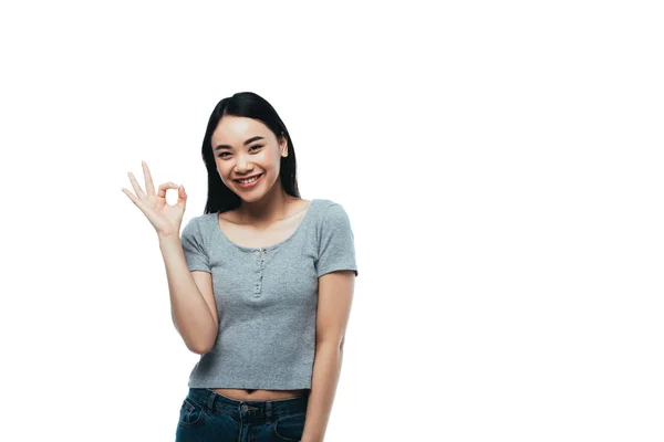 Happy attractive asian girl showing ok sign isolated on white — Stock Photo