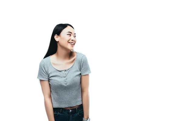 Felice ragazza asiatica guardando lontano isolato su bianco — Foto stock