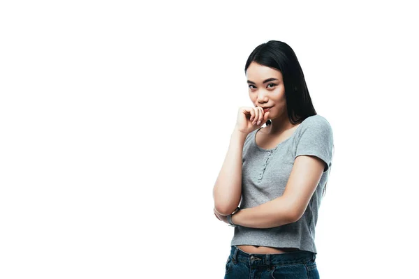 Timido asiatico ragazza guardando fotocamera isolato su bianco — Foto stock