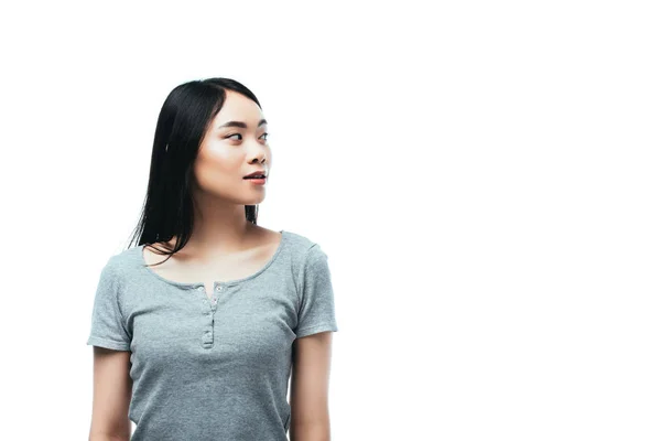Азіатська дівчина дивиться геть ізольовано на білому — стокове фото
