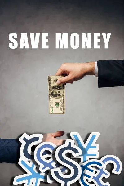 Cropped view man giving money to businessman on grey background with save money illustration — Stock Photo