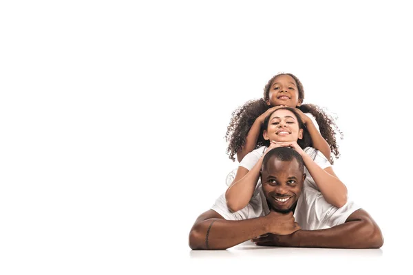 Happy african american woman lying on back of each other and smiling at camera on white background — Stock Photo