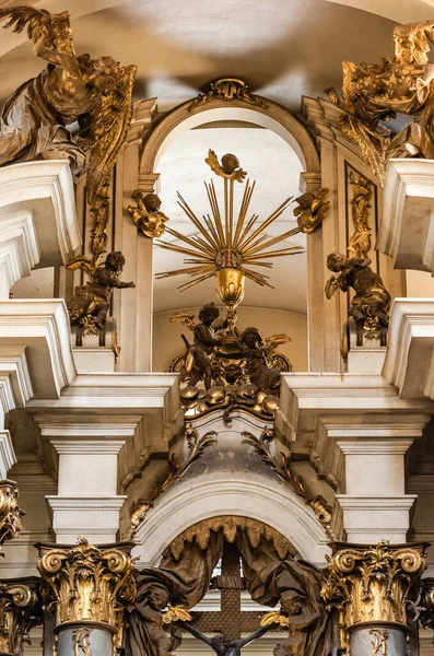 LVIV, UKRAINE - OCTOBER 23, 2019: low angle view of gilded statues of angels and archangels in dominican church — Stock Photo