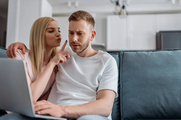 Selective focus of girl distracting freelancer boyfriend working from home — Stock Photo