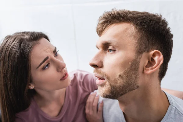 Young couple suffering from summer heat at home — Stock Photo