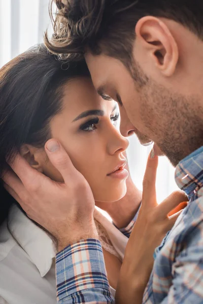 Selective focus of beautiful woman touching lips of boyfriend — Stock Photo