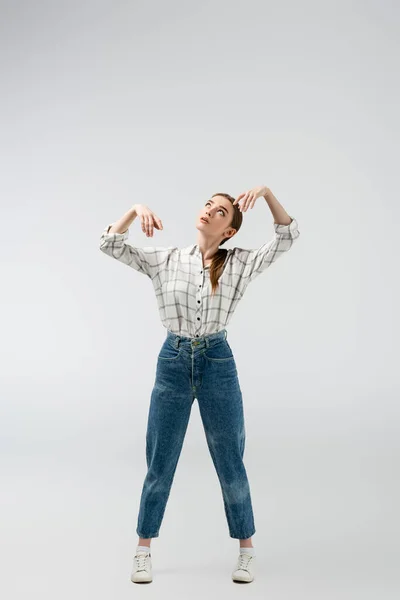 Attractive girl posing like puppet isolated on grey — Stock Photo