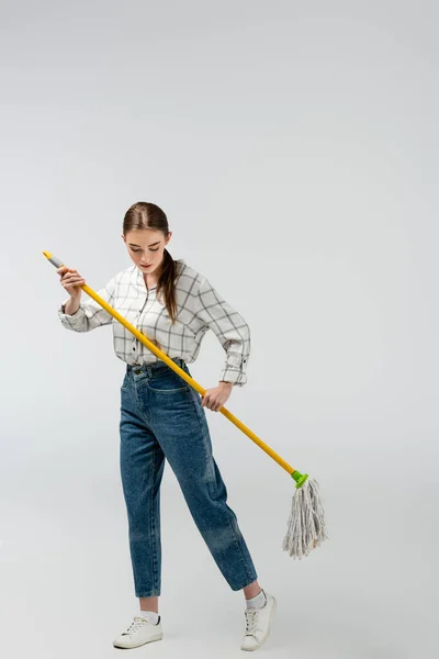 Attractive girl posing like puppet isolated on grey — Stock Photo