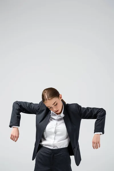 Geschäftsfrau Marionette im Anzug posiert isoliert auf grau — Stockfoto