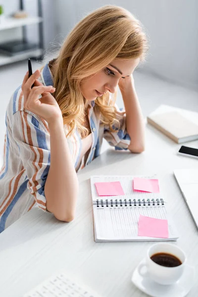 Overhead view of woman working with notebook — Stock Photo