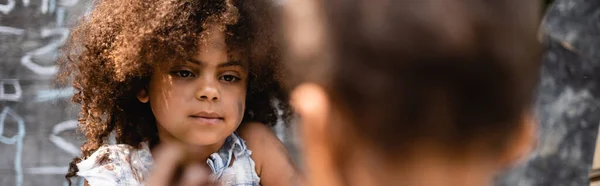 Horizontal crop of curly and poor african american kid near brother — Stock Photo
