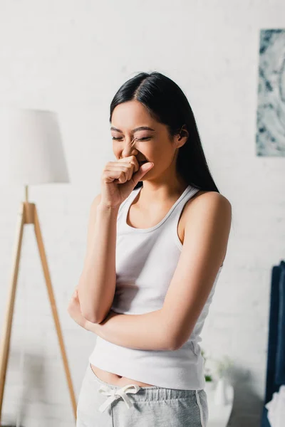 Young asian woman yawning during morning at home — Stock Photo