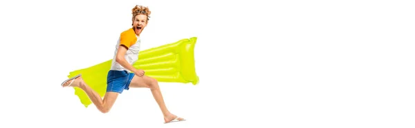 Panoramic crop of excited man with inflatable mattress jumping isolated on white — Stock Photo