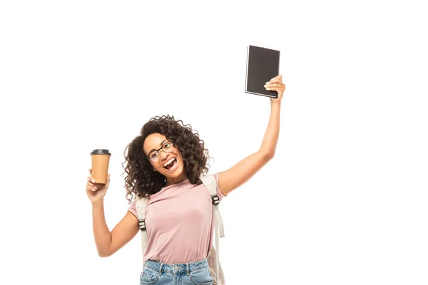 African american student with backpack holding disposable cup and notebook isolated on white — Stock Photo