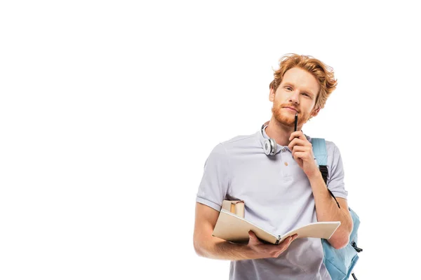 Panoramic crop of student with books and pen looking at camera isolated on white — Stock Photo