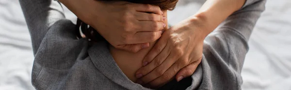 Panoramic crop of woman having neck pain at home — Stock Photo