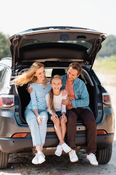 Parents looking at child while sitting in car truck outdoors — Stock Photo