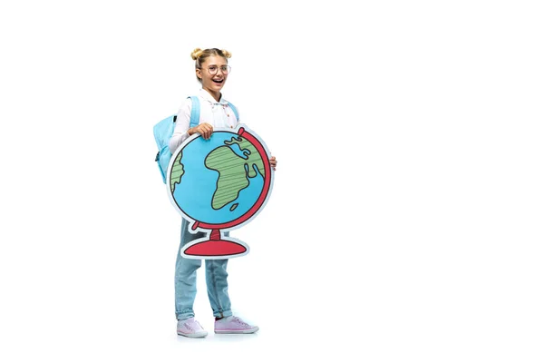 Full length view of excited schoolchild in eyeglasses holding paper cut globe while looking at camera on white — Stock Photo