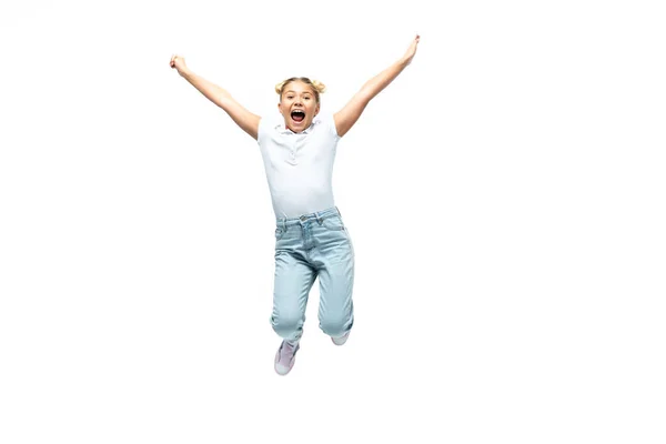 Excited schoolgirl jumping isolated on white — Stock Photo