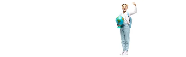 Panoramic shot of schoolkid with backpack and globe showing like on white background — Stock Photo