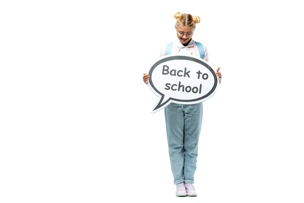 Schoolkid holding speech bubble with back to school lettering on white background — Stock Photo