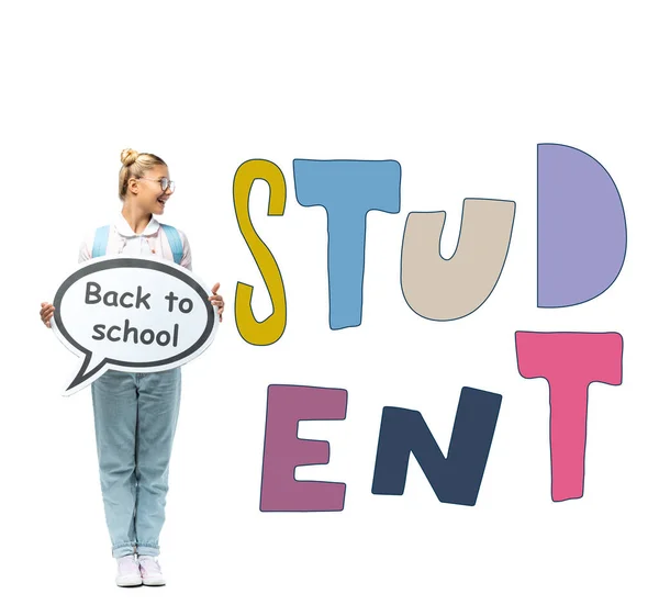 Schoolgirl holding speech bubble with back to school lettering near student illustration on white — Stock Photo