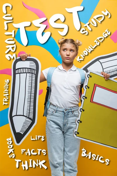 Thoughtful schoolkid holding paper pencil and notebook near lettering on yellow — Stock Photo
