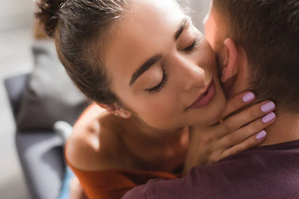 Happy woman with closed eyes hugging beloved man — Stock Photo